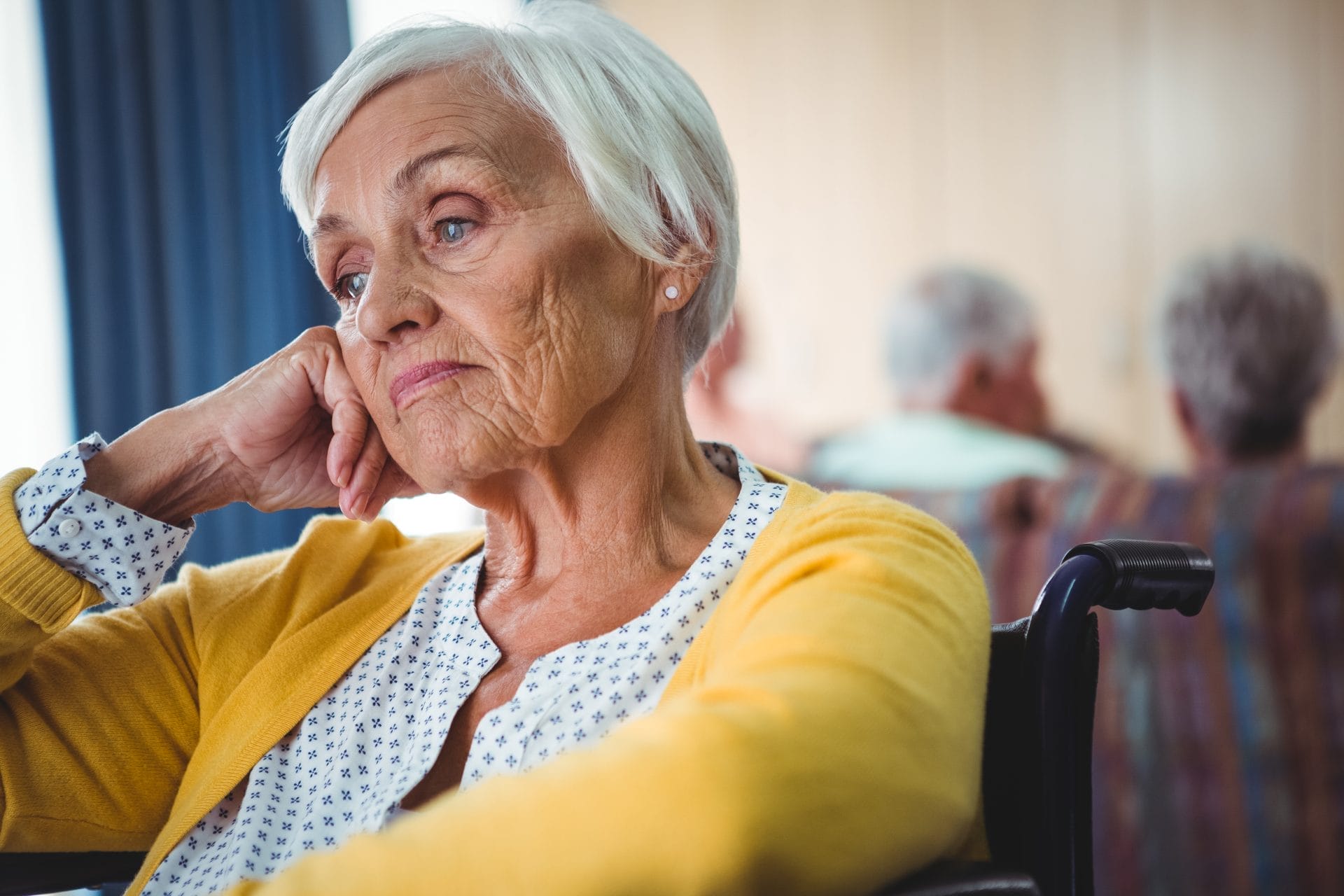 Senior Woman In wheelchair in senior living nursing home representing nursing home abuse in lebanon, TN